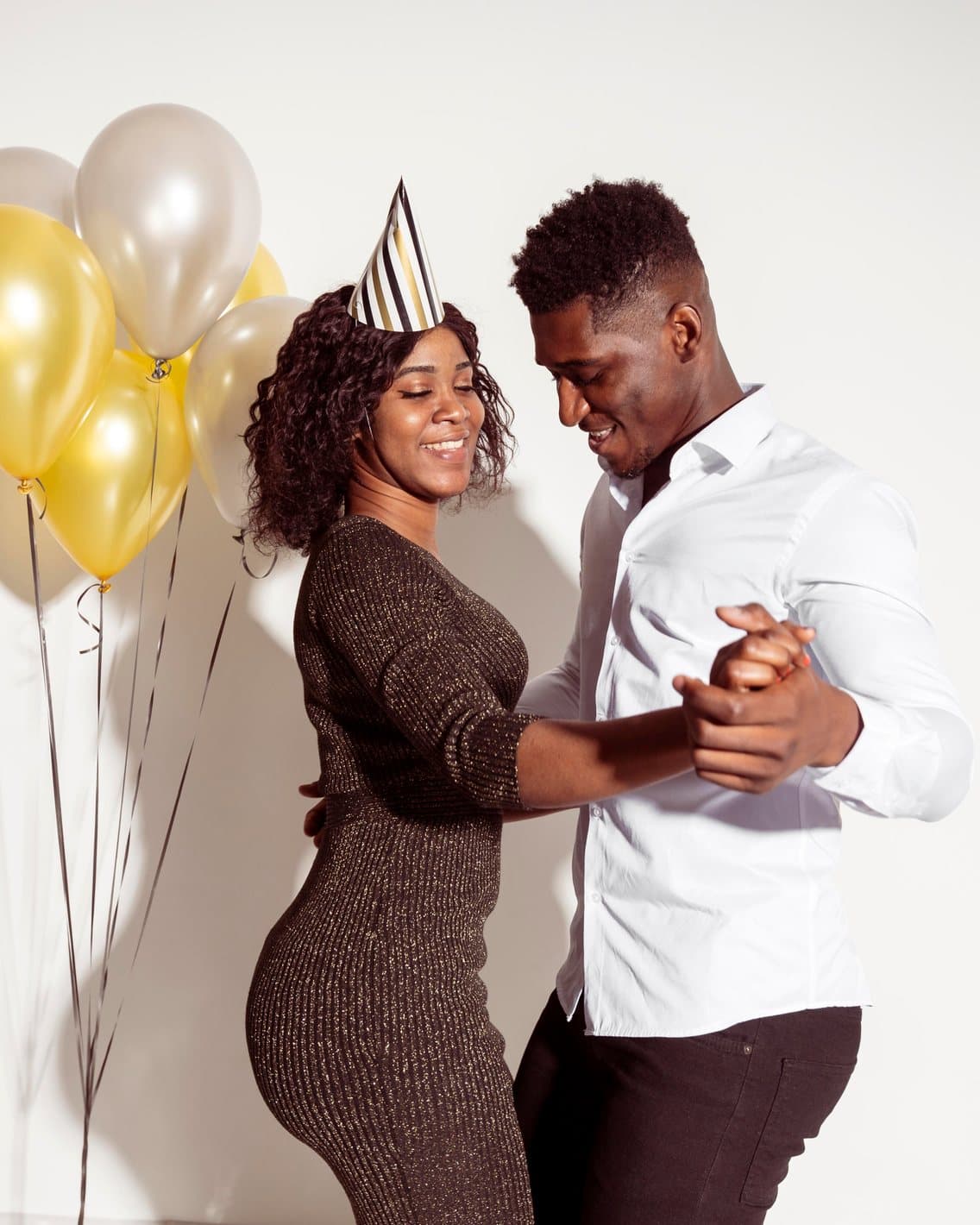 Couple dancing at a birthday party