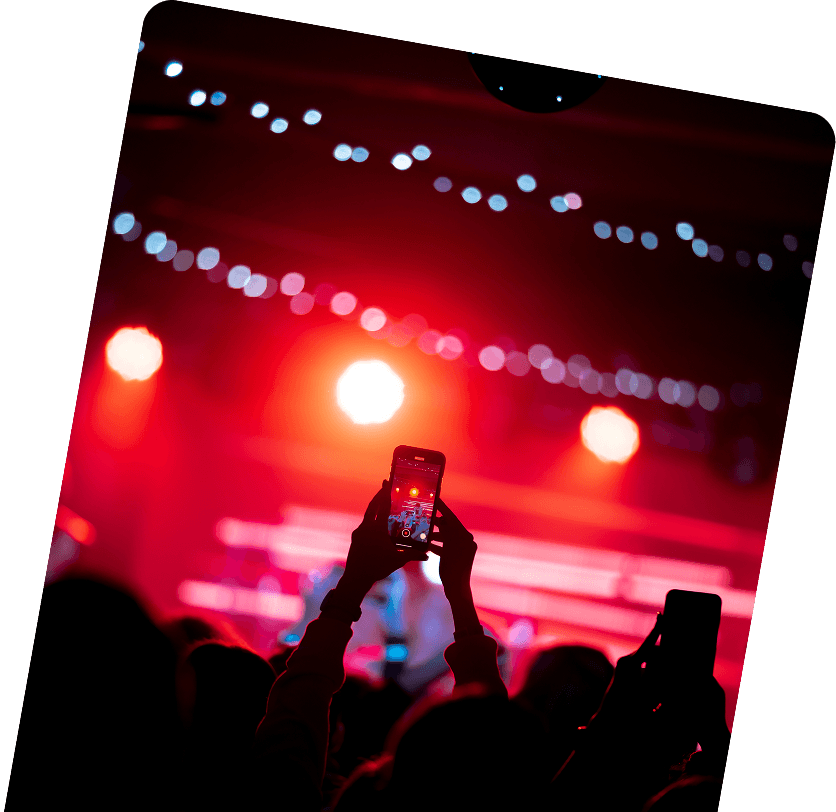 Crowd filming a concert stage